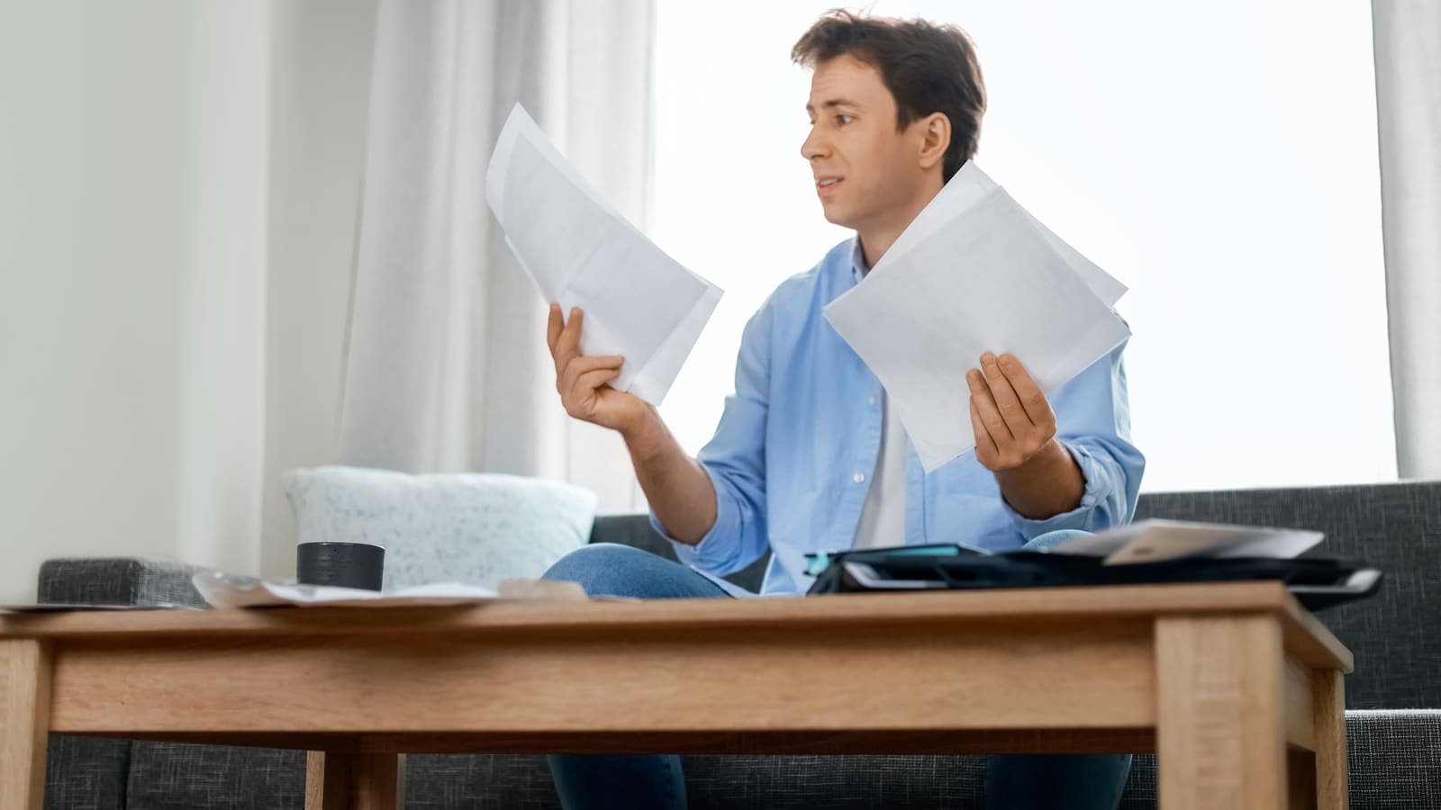 Homeowner reviewing property tax protest paperwork after an unfavorable decision