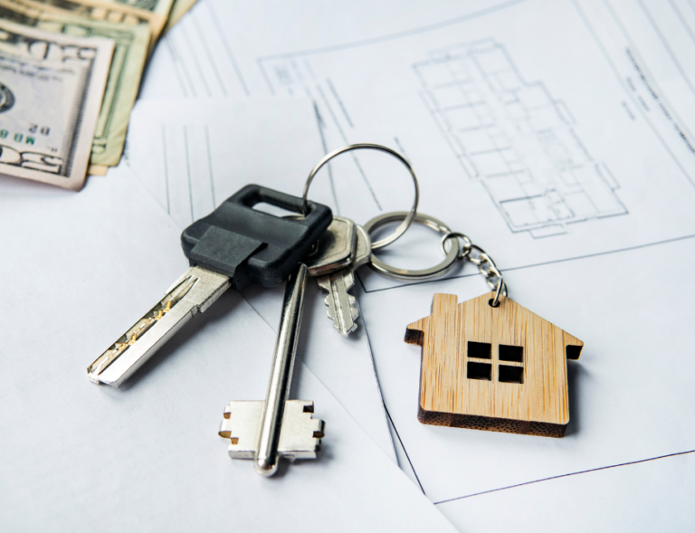 Keys and money on blueprints